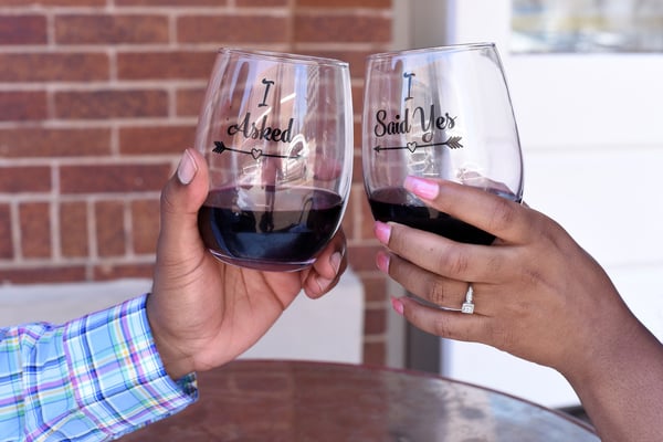 Engaged couple making a toast